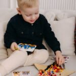 English looking child playing with various toys 